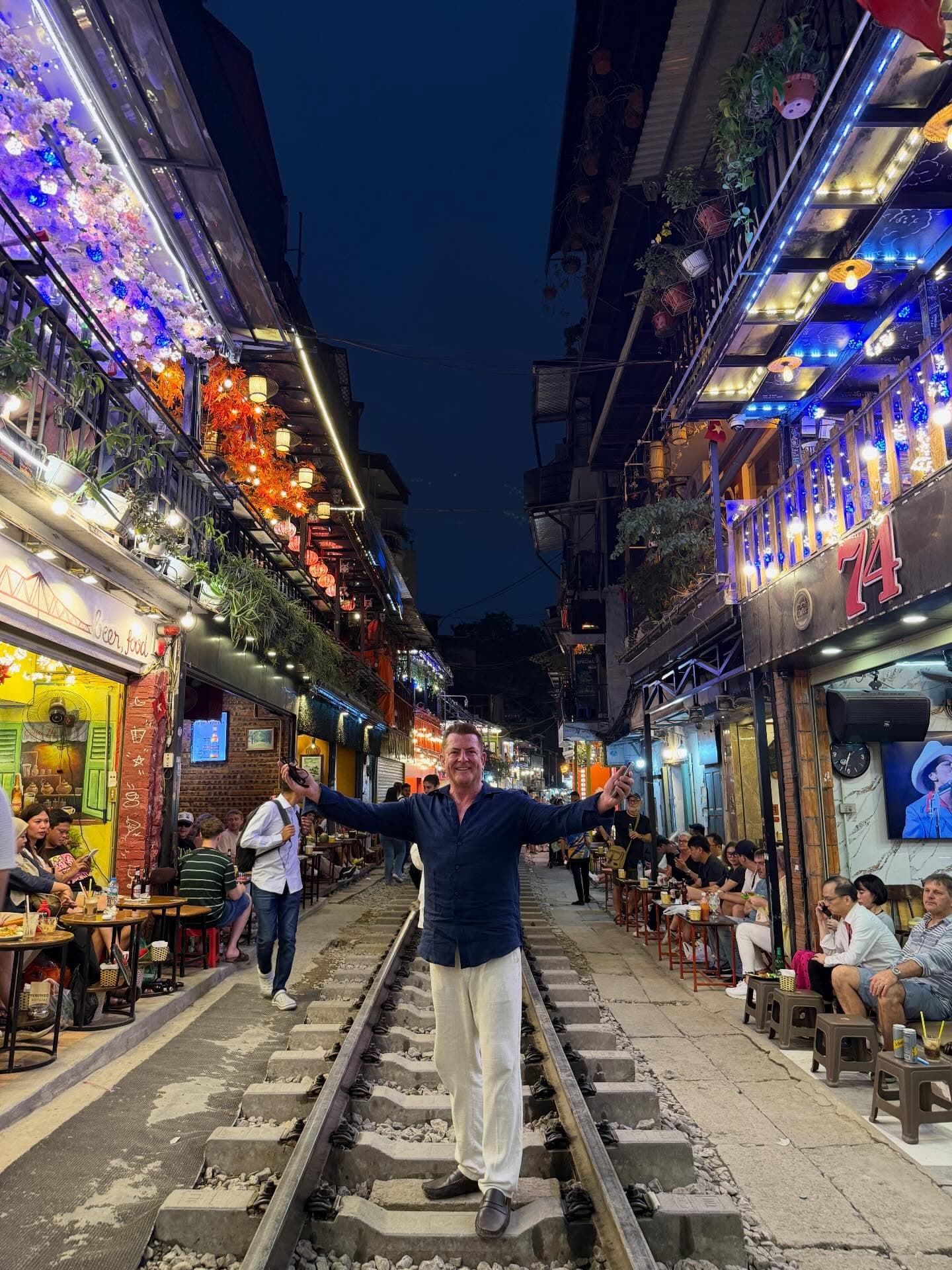 A lit street at night in Asia